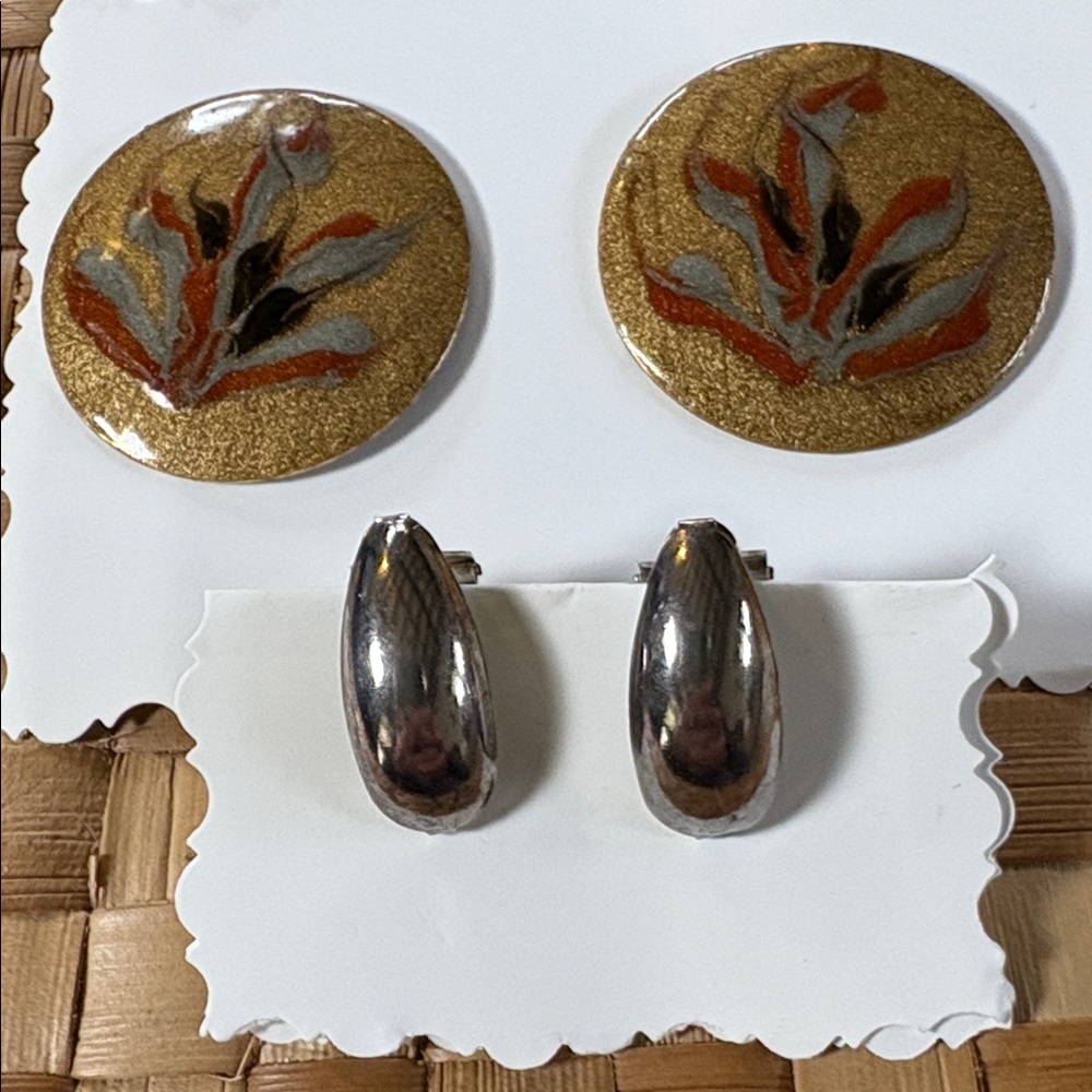 Two earrings, Gold and Black Round Earrings and silver plated oval earrings